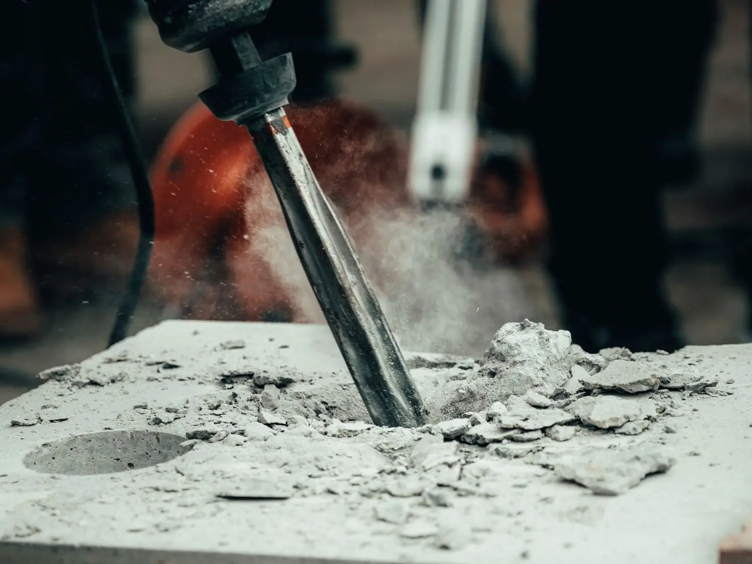 Jackhammer breaking a concrete slab